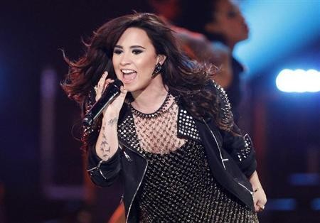 Demi Lovato in a December 2012 file photo. Lovato received outpouring support for the death of her pup Buddy. 