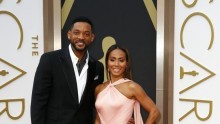 Actor Will Smith and wife Jada Pinkett Smith arrive at the 86th Academy Awards in Hollywood, California March 2, 2014.