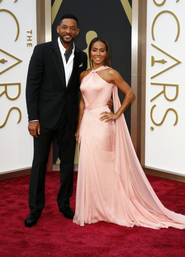 Actor Will Smith and wife Jada Pinkett Smith arrive at the 86th Academy Awards in Hollywood, California March 2, 2014.