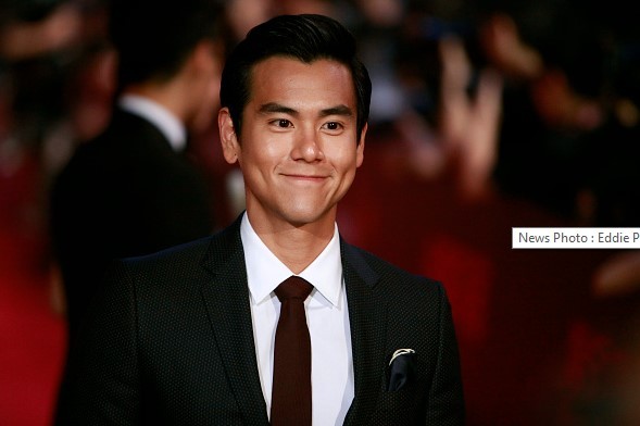 Eddie Peng poses for a picture on the red carpet at The 18th Shanghai International Film Festival on June 13, 2015 in Shanghai, China.