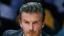 British soccer star David Beckham sits courtside as the Los Angeles Lakers play the Dallas Mavericks during their NBA basketball game in Los Angeles, October 30, 2012.