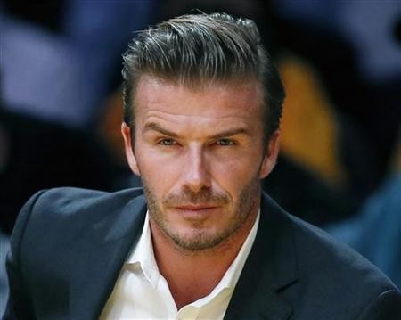 British soccer star David Beckham sits courtside as the Los Angeles Lakers play the Dallas Mavericks during their NBA basketball game in Los Angeles, October 30, 2012.