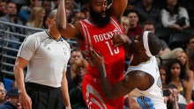 Houston Rocket Guard James Harden Being Guarded By Then Denver Nugget Ty Lawson