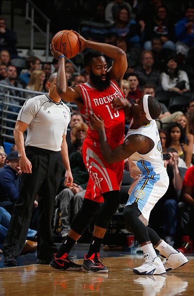 Houston Rocket Guard James Harden Being Guarded By Then Denver Nugget Ty Lawson