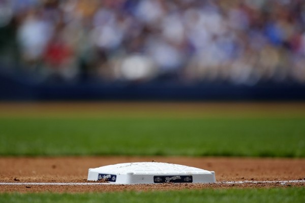  The Milwaukee Brewers logo adorns the third base during a game.