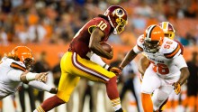 Redskins Quarterback Robert Griffin III runs a gain in a game against the Cleveland Browns on August 13, 2015