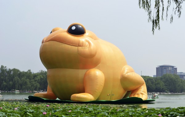 A giant inflatable toad is seen floating on a lake at the Yuyuantan Park in Beijing