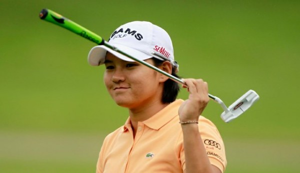 Yani Tseng of Chinese Taipei sinks a 12-foot birdie putt on the 18th hole to win against the United States