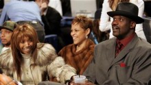 Singer Brandy (L) sits in audience with Miami Heat center Shaquille O'Neal (R) 