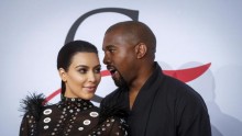 Television personality Kim Kardashian arrives with Kanye West 