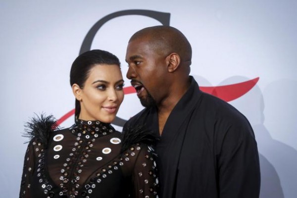 Television personality Kim Kardashian arrives with Kanye West 