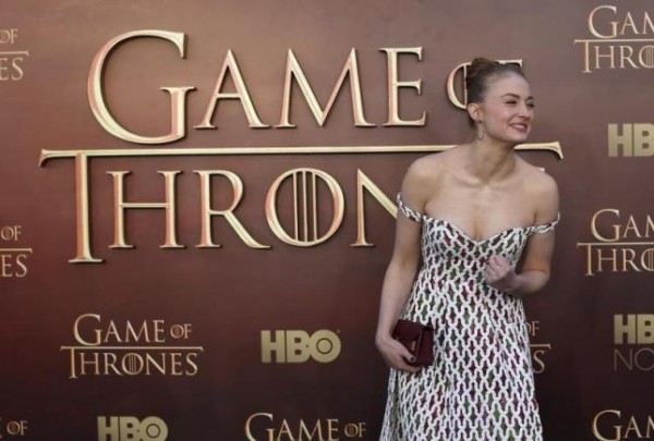 Actress Sophie Turner gestures while arriving for the season premiere of HBO's ''Game of Thrones''