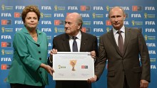 Russian President Vladimir Putin receiving signed certificate from Brazil President Dilma Rousseff and FIFA president Joseph Blatter