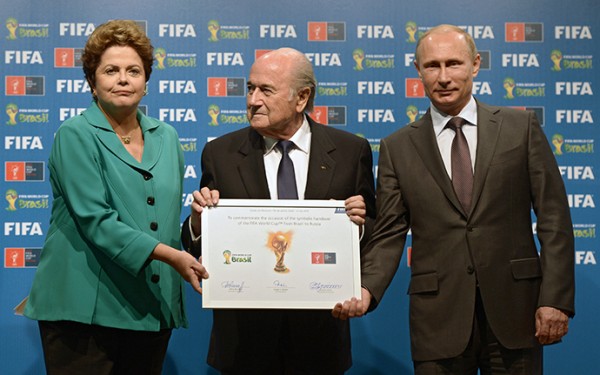 Russian President Vladimir Putin receiving signed certificate from Brazil President Dilma Rousseff and FIFA president Joseph Blatter