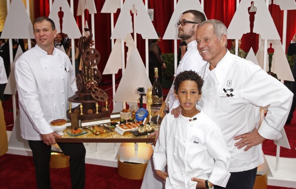 Celebrity chef Wolfgang Puck (R) and his team show off his Oscars creations 