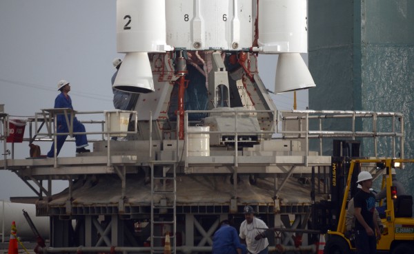 NASA engineers prep a launch vehicle.