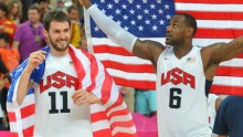 Kevin Love and LeBron James carrying US flags during the 2012 Summer Olympic Games in London