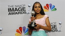 Actress Kerry Washington holds her award in the press room 