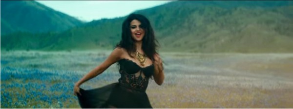 Selena Gomez is dancing in the midst of wildflowers in her official video "Come And Get It."
