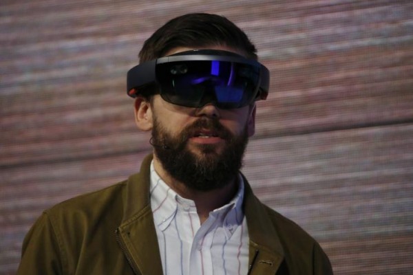 This Microsoft HoloLens is  a set of goggles and software that imposes computer-generated images over real-world scenes for about $3,000 cost.