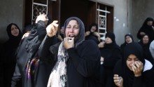 Relatives of Palestinian man mourn at his funeral during the Muslim holiday of Eid al-Fitr 