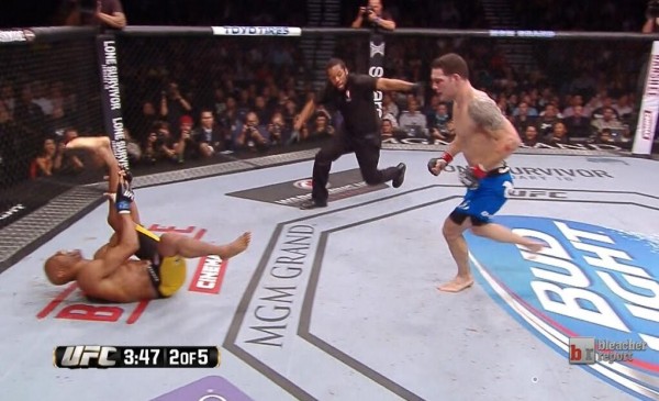 Anderson Silva goes down in agony after a checked leg kick from Chris Weidman in UFC 168
