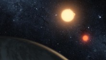 In this handout digital illustration released on September 15, 2011 by NASA, the newly-discovered gaseous planet Kepler-16b orbits it's two stars. 