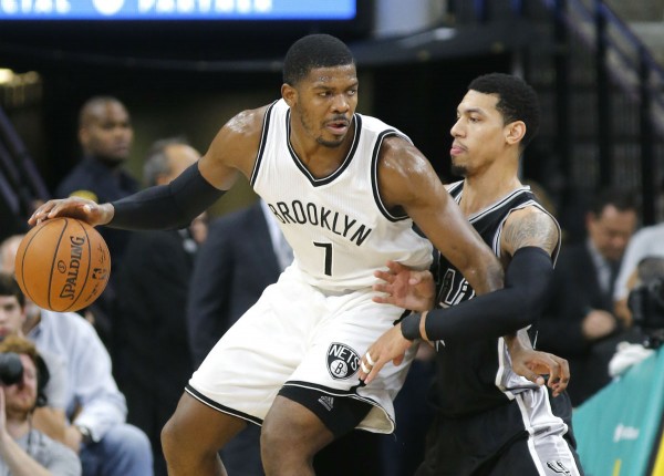 Brooklyn Nets shooting guard Joe Johnson posts up San Antonio Spurs' Danny Green