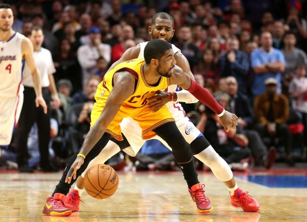 Cleveland Cavaliers point guard Kyrie Irving posts up against Los Angeles Clippers' Chris Paul