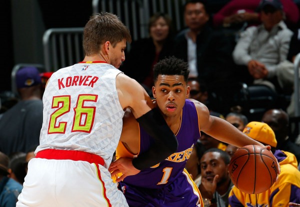 Los Angeles Lakers rookie D'Angelo Russell dribbles against Atlanta Hawks' Kyle Korver