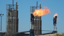 A new Stanford-led study finds that global fossil-fuel emissions, like the carbon dioxide emitted from this natural gas flare at a North Dakota oil well, could show a decline this year.