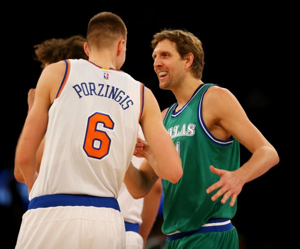 New York Knicks' Kristaps Porzingis (L) and Dallas Mavericks' Dirk Nowitzki