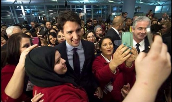 Canadian Prime Minister Justin Trudeau personally greets planeload of Syrian refugees in Toronto