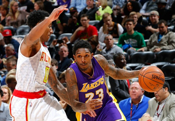 Los Angeles Lakers shooting guard Lou Williams (R) drives against Atlanta Hawks' Jeff Teague