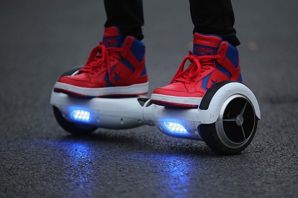 A youth poses as he rides a hoverboard, which are also known as self-balancing scooters and balance boards, on October 13, 2015 in Knutsford, England.