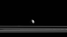 Saturn's moons, Enceladus and Tethys line up almost perfectly for Cassini's cameras.