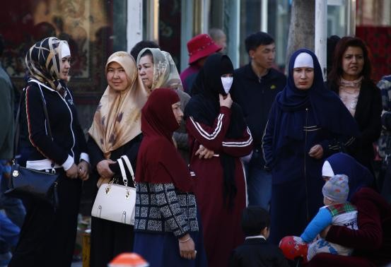 Uighur women in downtown Urumqi, Xinjiang Uighur Autonomous Region, May 1, 2014.