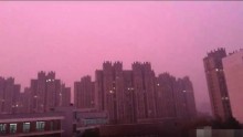 Nanjing's sky covered by pink to purple smog