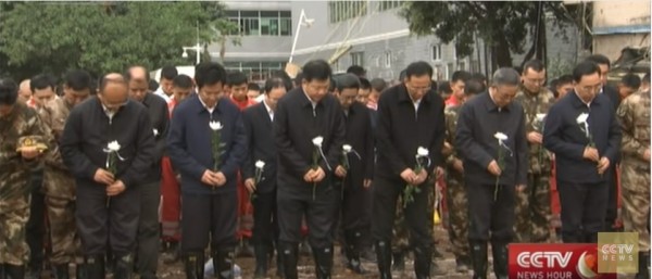 Officials and rescuers mourn and remember the lives lost during the Shenzhen landslide