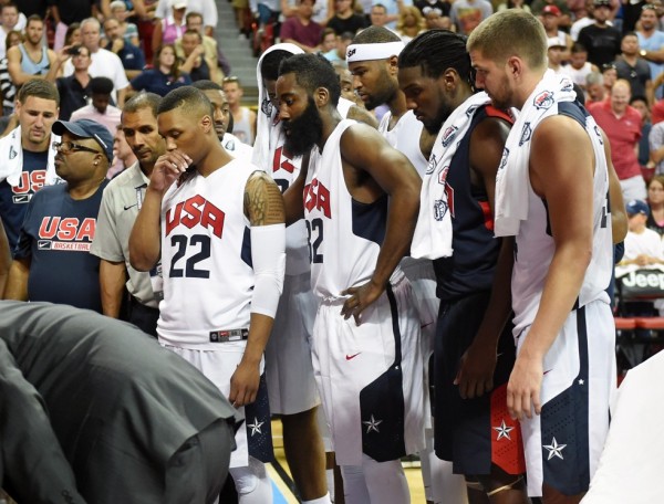 Team USA looks on as Indiana Pacers' Paul George is attended to by doctors during a scrimmage game last week