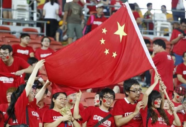 China fans wave the national flag before the Asian Cup quarter-final soccer match between China and Australia at the Brisbane Stadium