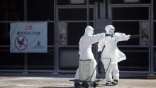 Workers in anti- virus gear