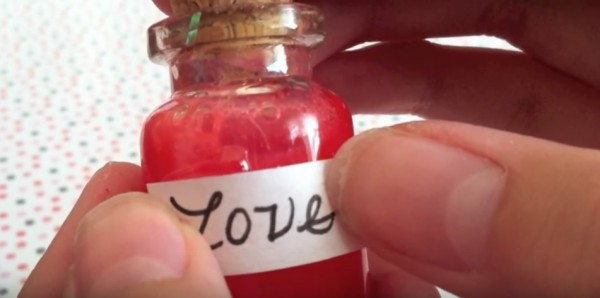 Man caught pouring 'love potion' to a woman's bottled water