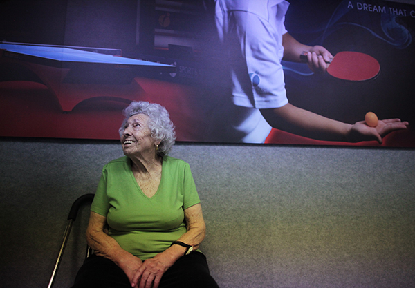 Freyda Dvorak, 87, takes a break while playing ping pong at a program for people with Alzheimer's and dementia at the Arthur Gilbert table tennis center in Los Angeles, California June 15, 2011. 