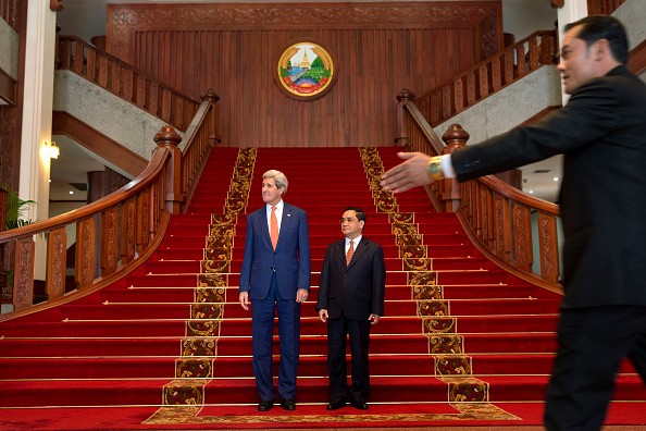 US Secretary of State John Kerry (L) stands with Laos Prime Minister Thongsing Thammavong after their meeting at the prime minister's office in Vientiane on Monday.