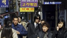 Tourists are seen at the MyungDong shopping district on March 3, 2006 in Seoul, South Korea. 