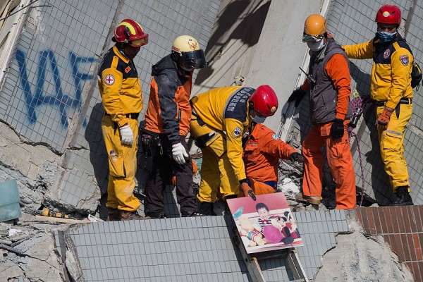 Rescuers found a photo of a boy in the rubble of a toppled building