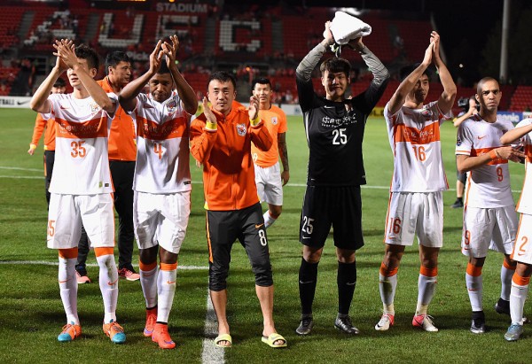 Shandong Luneng players celebrate after their 2-1 win over Adelaide United