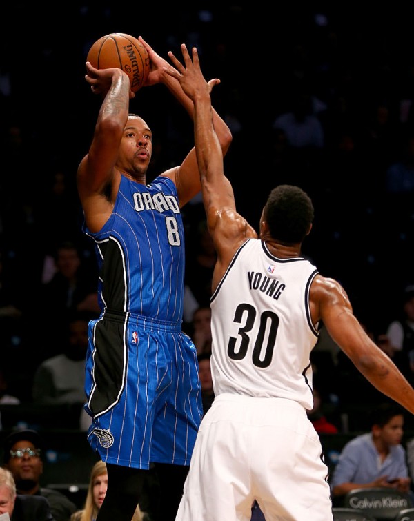 Former Orlando Magic power forward Channing Frye shoots over Brooklyn Nets' Thaddeus Young