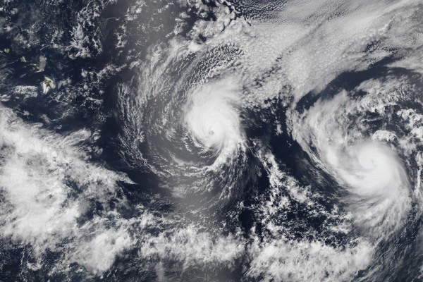 Hurricane Iselle and Hurricane Julio (R) are pictured en route to Hawaii 